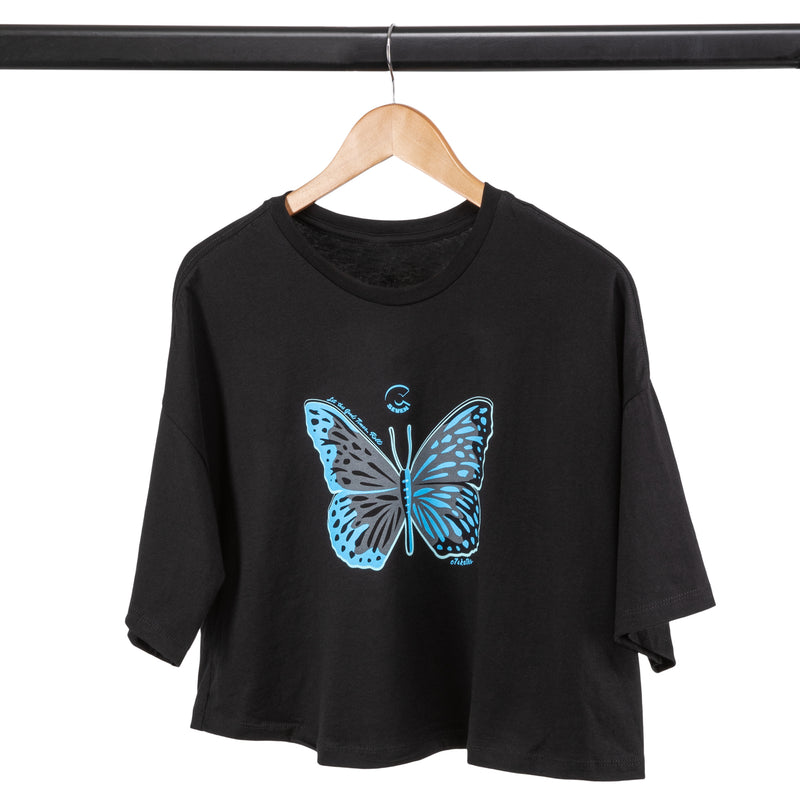C7skates Magical Butterfly Crop T-Shirt features a blue and gray print in a relaxed, mid-length fit with a tear-away label.