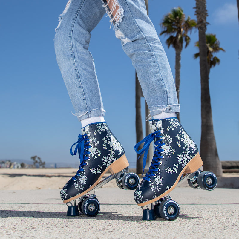 black floral quad roller skates