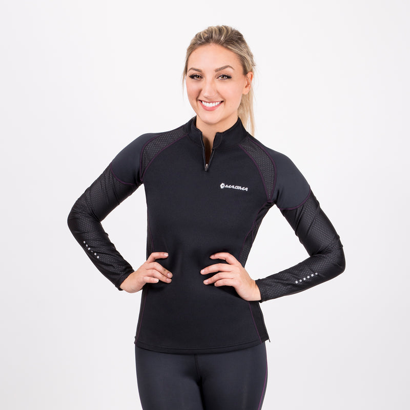 A black long-sleeve neoprene workout shirt with purple stitching for women